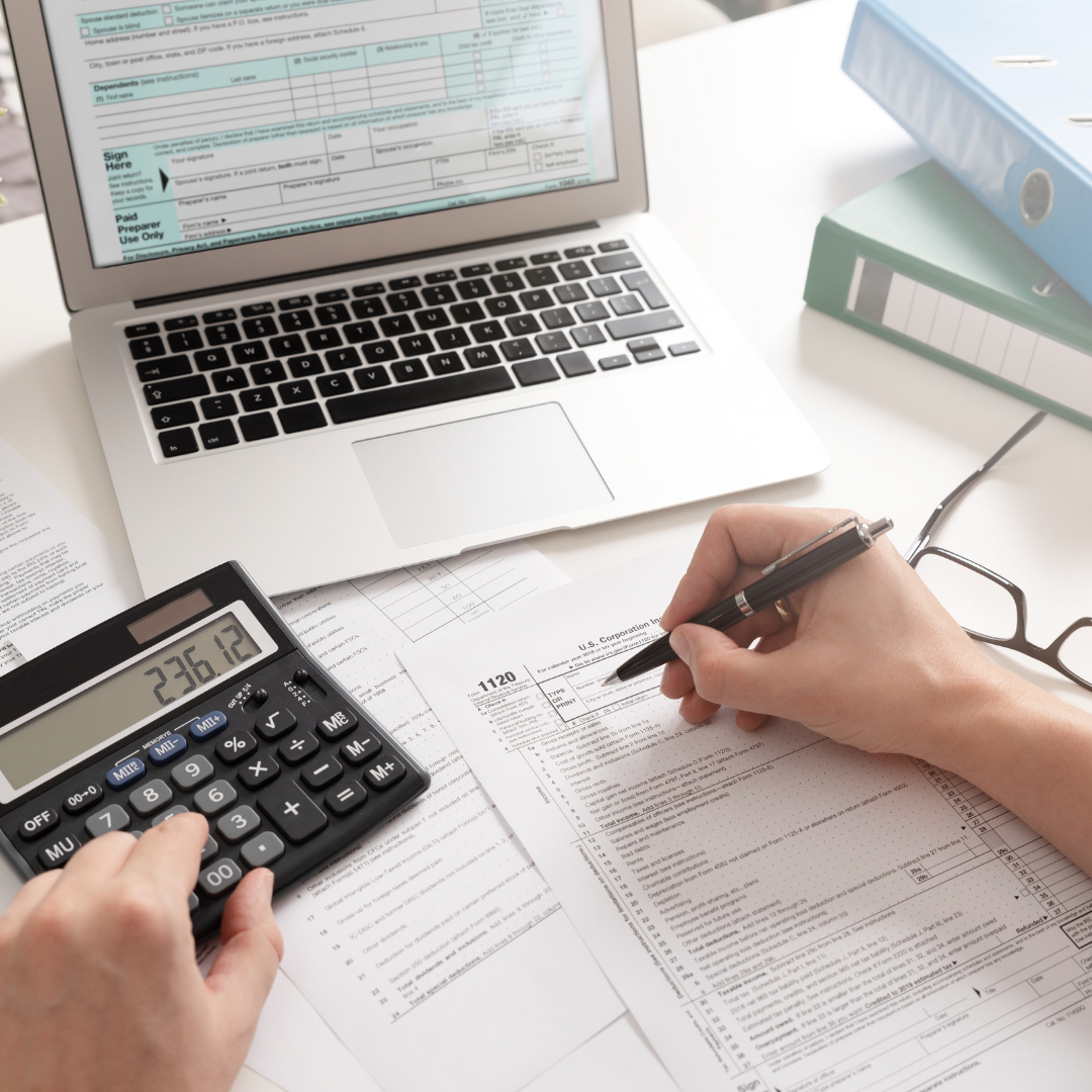 Accountant writing financial plan for dentist