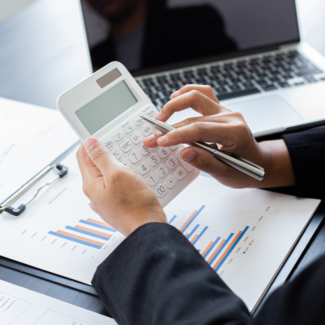 Tax accountant using white calculator