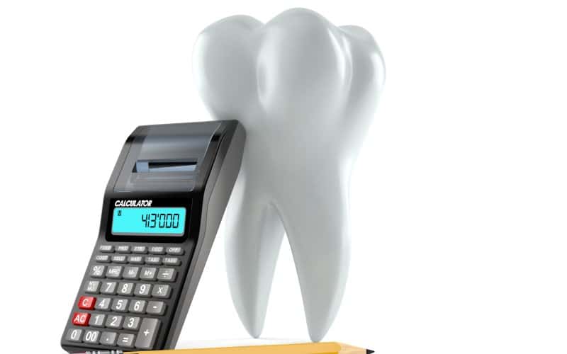 tooth with calculator and pencil