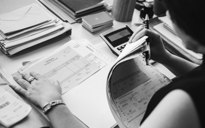 woman checking reports and receipts