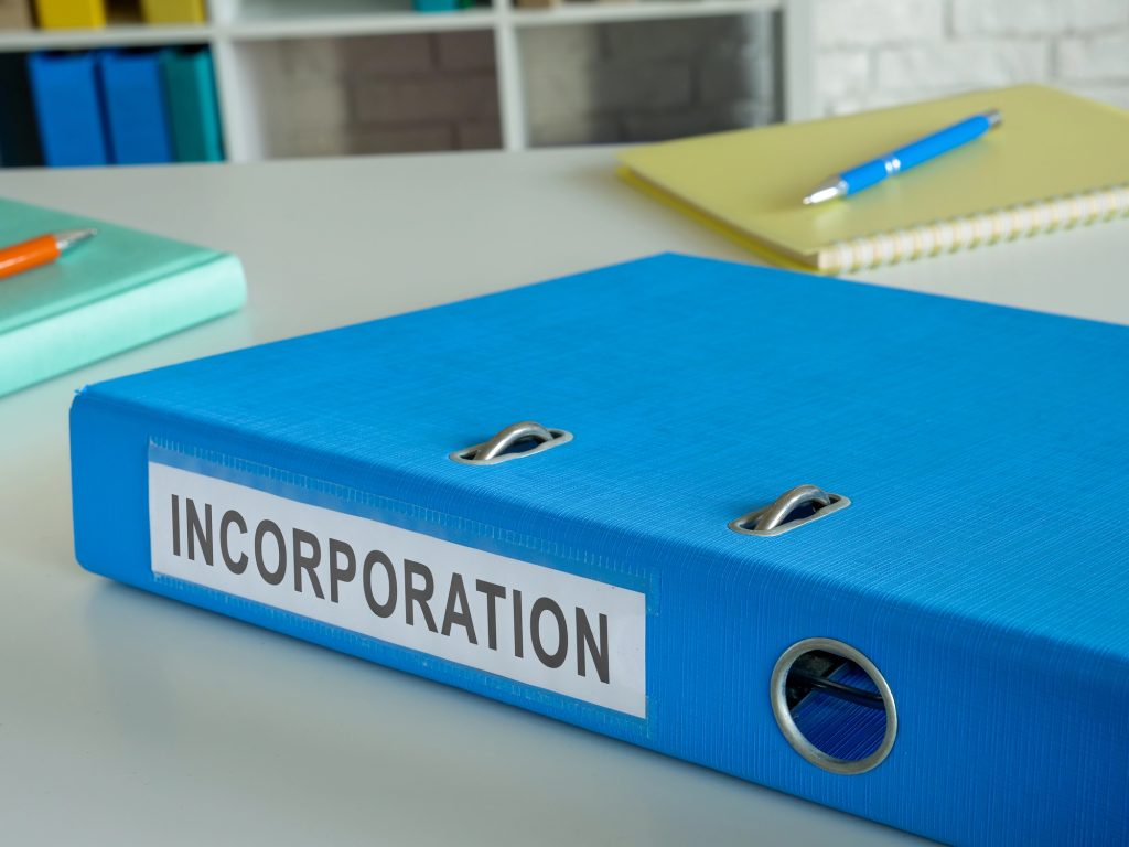 Business incorporation documents folder placed on professional desk